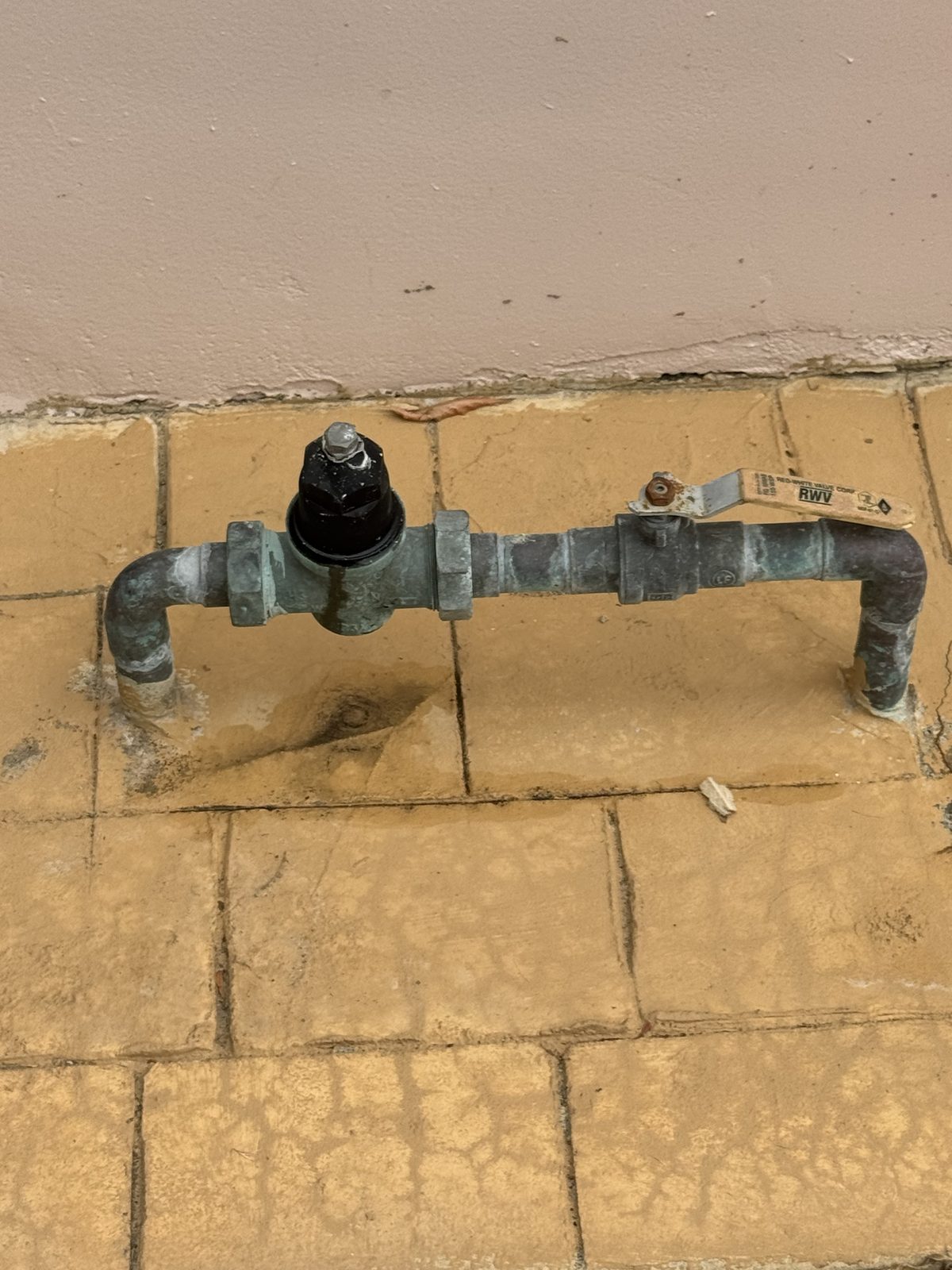 Before: old corroded pressure reducing valve on galvanized pipe, leaving the home on dangerously high water pressure